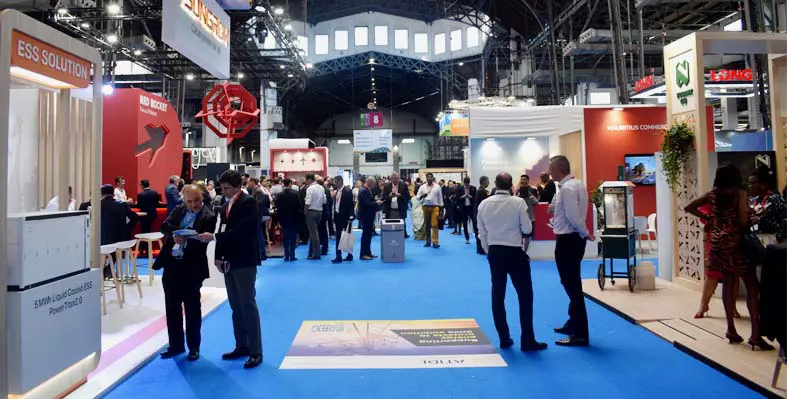 Africa Energy Forum 2024 was held in the Fira de Montjuïc in Barcelona. (Image source: ACP) A picture of the exhibition floor from aef with delegates speaking at stands.